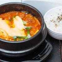 Budae Stew (Aka : Army Stew) · Ham, sausage, baked beans & ramyun noodles in Kimchi & bone broth topped with cheese.
