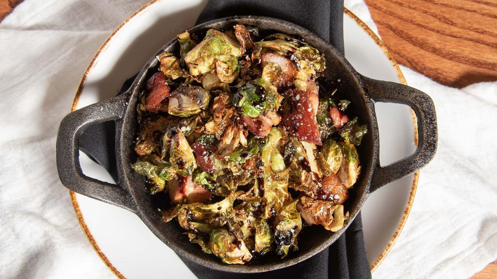 Shaved Brussel Sprout · Dried cranberry, apples, sunflower seeds, shaved parmesan, housemade maple dijon dressing, candied walnuts.