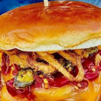 Southwest Burger · Cheddar, Tobacco Onions and Fried Jalapeños, Sriracha Aioli, Calabrese Peppers.