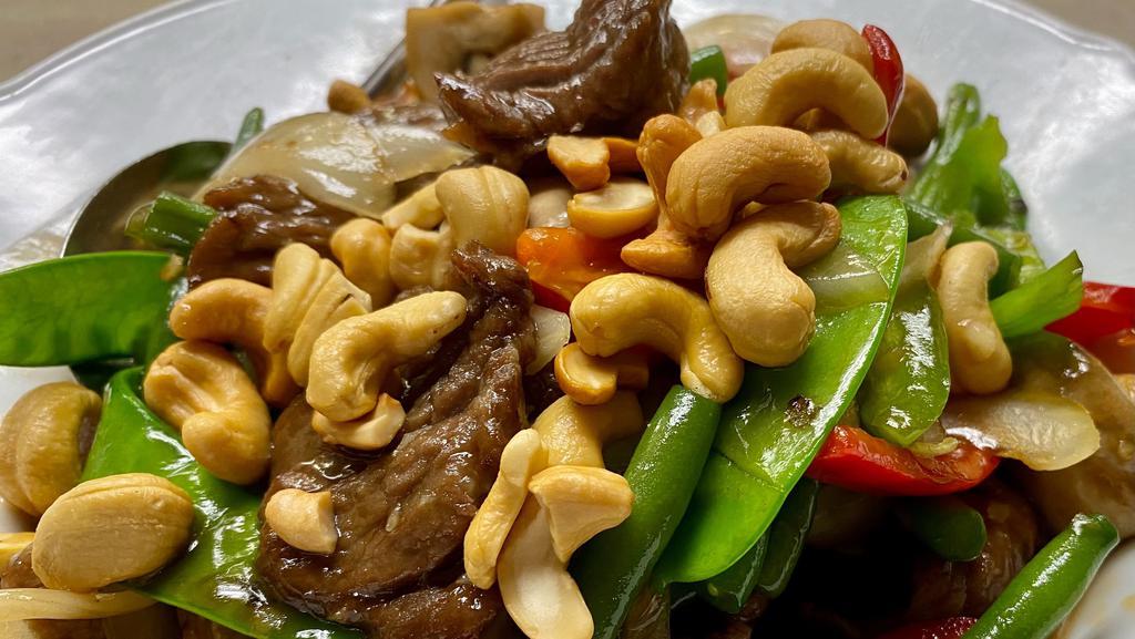 Cashews · Carrots onions white mushrooms snow peas bell peppers and cashew nuts (cashew beef has no carrots and is not spicy)