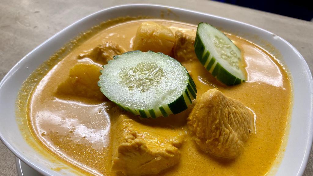 Curry Chicken With Rice* · Malaysian curry chicken, and potatoes