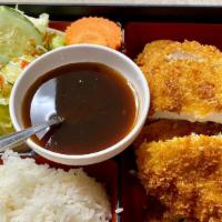 Chicken Katsu · Slices of crispy chicken with Japanese bread crumbs
