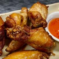 Wings · Choice of traditional fried marinated chicken wings served with sweet chili sauce or honey g...