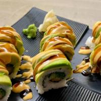 Wakame Shrimp Maki* (Inside Out) · Shrimp tempura, seaweed salad, and cucumber, topped with avocado, and house sauce