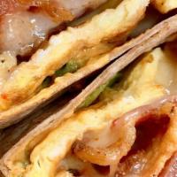 Ranchero Wrap · Three eggs, pepper Jack cheese, jalapeño salsa cream cheese, and bacon.