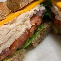 Empire State Club · Toasted multi grain bread, turkey, bacon, lettuce, tomato, onion, and mayo. Served with choi...