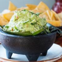 Guacamole · Lime, cilantro, jalapeño, tomato, and red onion. Served with corn tortilla chips.