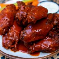 Valentina Wings · Served with carrots, celery, and blue cheese dressing. 5 wings in half order, 10 in full.