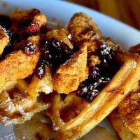 Chicken & Waffles · Chicken fried dark & crispy, cranberry bourbon maple syrup & warm cinnamon butter