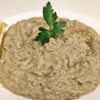 Baba Ghanoush · Smoked eggplant puree blended with tahini, olive oil, garlic, herbs and spices.