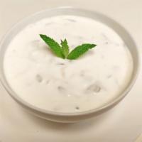 Tzatziki · Finely chopped baby cucumbers blended with garlic, dill, olive oil and yogurt.