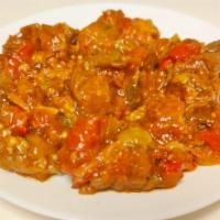 Eggplant In Sauce · Fried eggplant, green peppers, red peppers blended with tomato sauce.