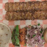 Adana Kebab · Traditionally made of minced lamb mounted on a skewer and grilled over charcoal served with ...