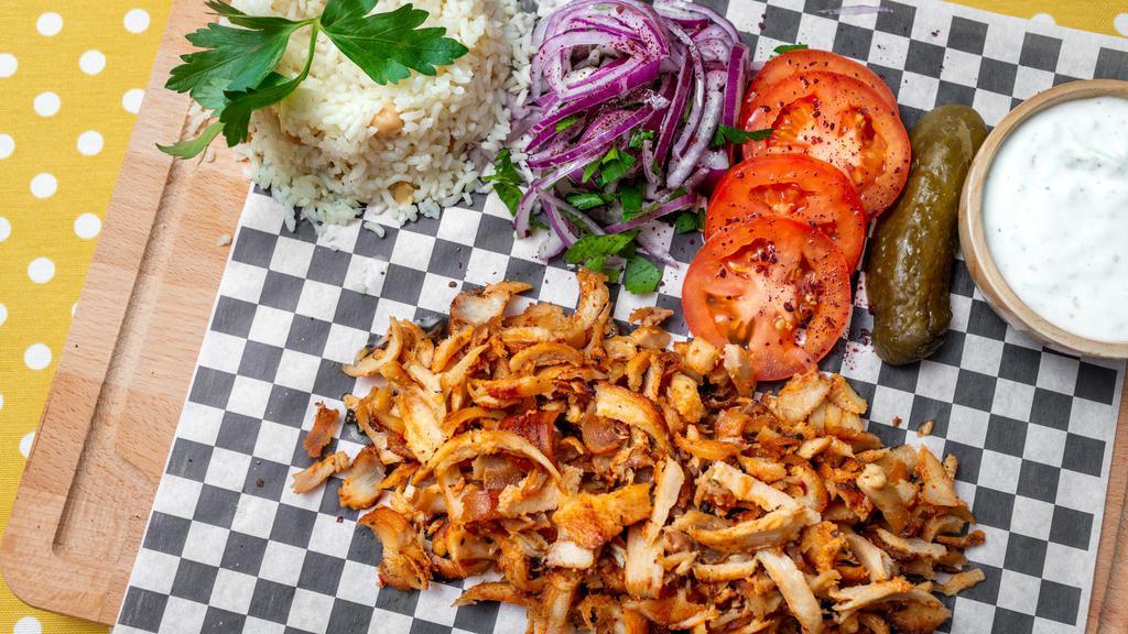 Chicken Gyro Plater · Traditionally made with chicken meat and grilled on a vertical spit of stacked meat slices, served with rice, tzatzki, onion, grilled pepper and tomato.