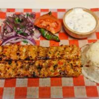 Chicken Adana Kebab · Traditionally made of minced chicken mounted on a skewer and grilled over charcoal served wi...
