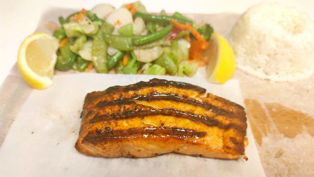 Grilled Salmon · Grilled salmon served with steamed vegetables and rice.