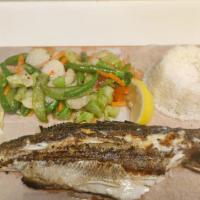 Grilled Branzino · Grilled whole branzino served with steamed vegetables and rice.