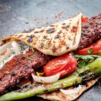 Lamb Adana Wrap · Traditionally made of minced lamb mounted on a skewer and char grilled.