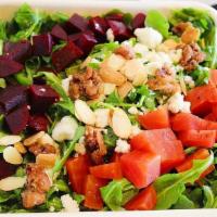 Roasted Beet Salad · arugula, golden & red beets, goat cheese, candied walnuts, toasted almonds & honey lime dres...