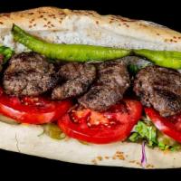 Kofte · Our delicious Lamb and beef patties in a freshly baked pita bread and tzatziki sauce, lettuc...