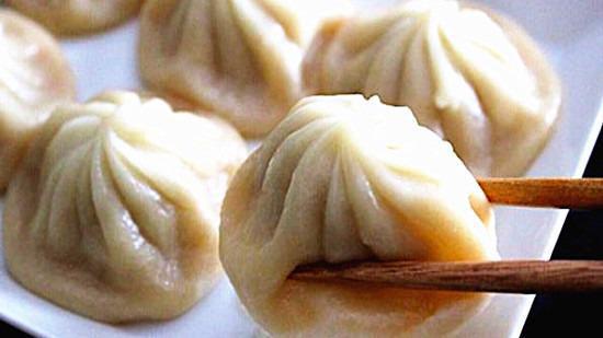 Soup Dumplings (8) 小籠包 · 8 pcs, Steamed dumpling consisting of a paper thin wrapper enveloping a seasoned pork filling and hot, flavorful soup