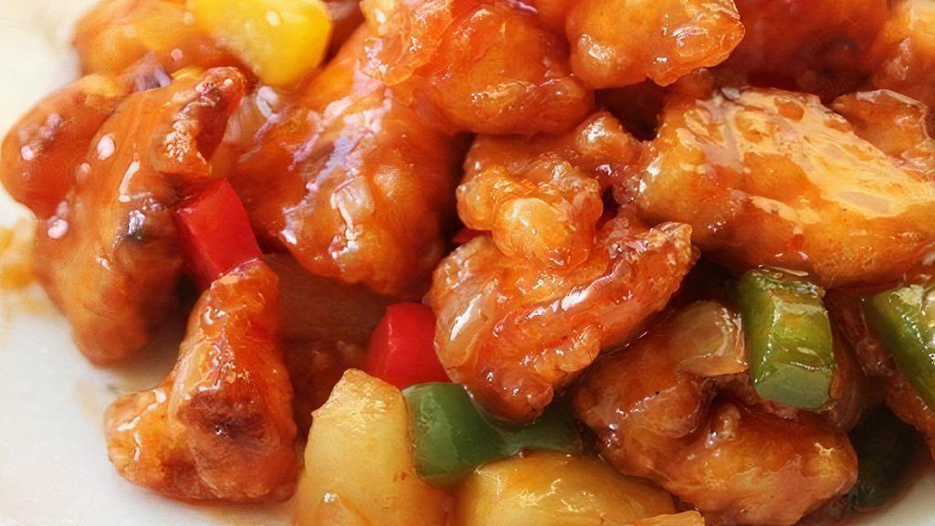 Sweet And Sour Chicken Or Pork 菠萝甜酸鸡/肉 · Deep-fried chicken or pork pieces in sweet and sour sauce with pineapple, bell peppers, onion and tomato.