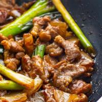 Mongolian Lamb 蒙古羊 · Stir fried with thin slices of Lamb simmered scallion, snow peas in a soy, brown sugar, garl...