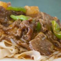 Beef Chow Fan (Wet) · Beef and wide noodle stir-fried with scallions, onion, ginger, bean sprouts with the gravy o...