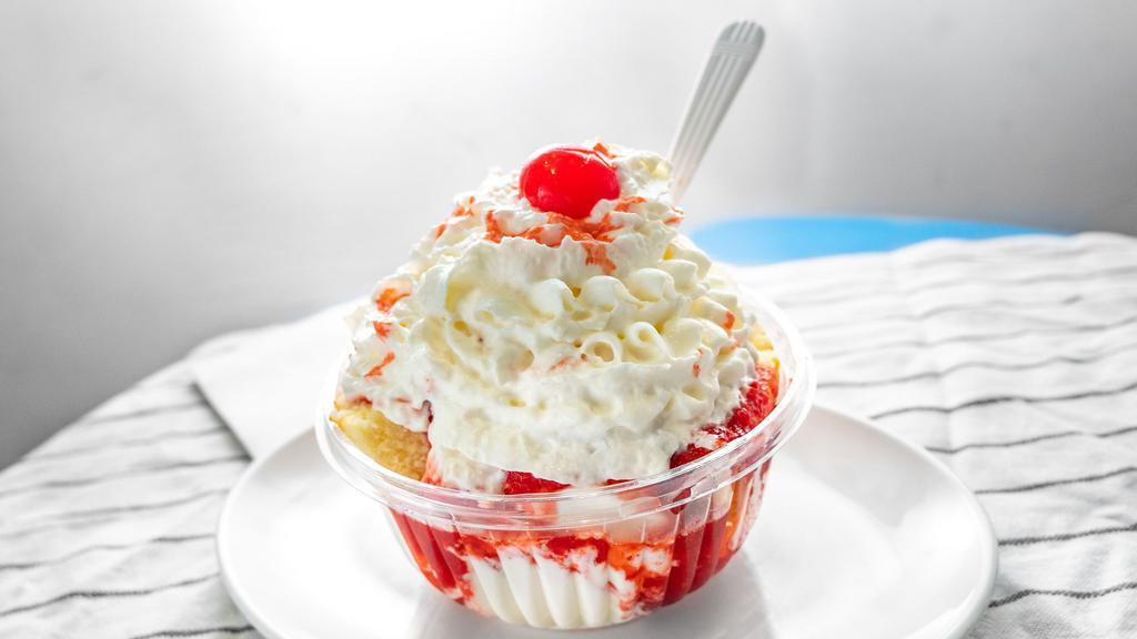 Strawberry Shortcake Sundae With Hard Ice Cream · Vanilla ice cream, pureed strawberries, sliced pound cake, whipped cream and a cherry.