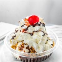 Hot Fudge Brownie Sundae With Custard Ice Cream · Vanilla ice cream, hot fudge, sliced brownies, whipped cream and a cherry. Add brownie for a...