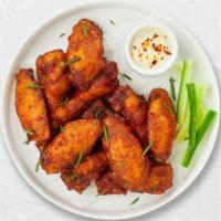 Chicken Wings · Fresh chicken wings breaded and fried until golden brown.