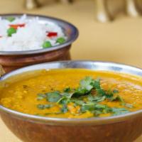 Ekta Dal · Vegetarian. Yellow lentil cooked with onion and tomato.