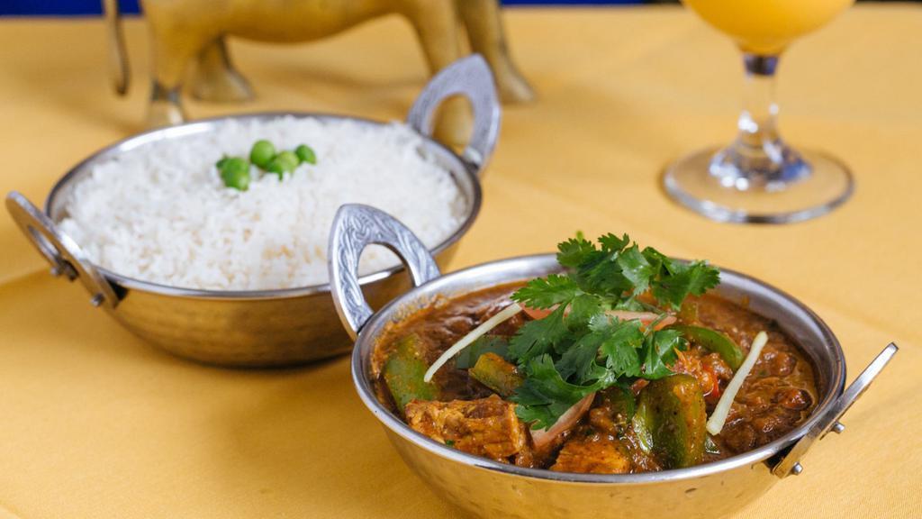 Lamb Rogan Josh · Traditional lamb curry from Kashmir with onion and tomato sauce, in touch of yogurt.