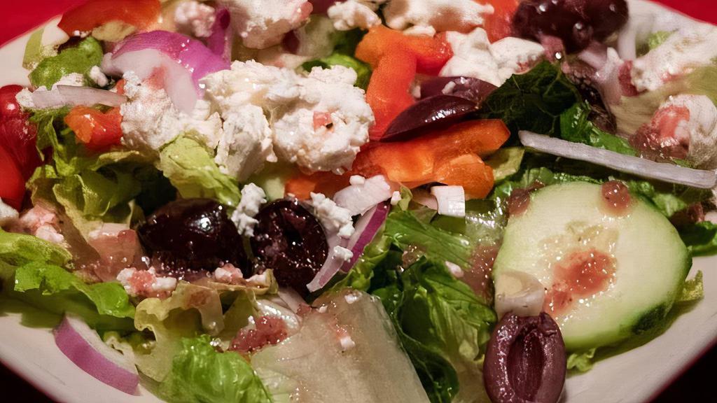 Personal Greek Salad · Crisp lettuce, cucumbers, tomato, Kalamata olives, red onion, feta cheese, and red peppers, with house Italian dressing.