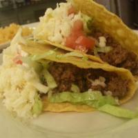 Crispy Tacos · Corn tortillas shell your choice tomatoes, lettuce, cheese served with rice and beans.