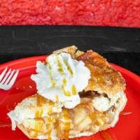 Slice Hot Caramel Apple Pie · Apple pie, caramel, whip cream and cherry.