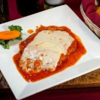 Pollo Parmigiana · Boneless chicken breast lightly fried with mozzarella cheese and tomato sauce.