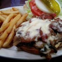 Tellez Marella Burger · Juicy burger with melted Swiss cheese, crispy bacon, sautéed mushrooms, lettuce, raw onions ...