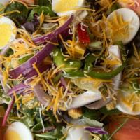 Garden · Mixed greens, tomato, cucumber, red onion, egg, shredded cheddar cheese, croutons.