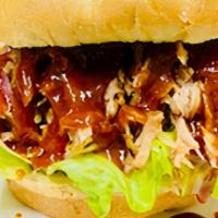 Pulled Pork Sandwich ( New ) · PULLED PORK 
Served on a toasted Hamburqer roll w/ option of  veggies