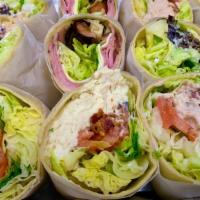 Portfolio Chicken Salad Wrap · Our delicious homemade chicken salad, American cheese, lettuce, tomatoes and bacon. Served i...