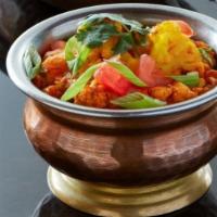 Aloo Gobhi · Cauliflower, potato, tomato, and cumin. Served with rice.