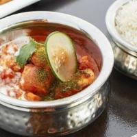Tikka Masala · Tomato, onion and spice blend. Served with rice.