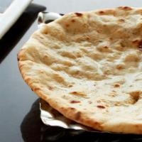 Peshawari Naan · White flour bread filled with almond, pistachio, coconut and cashew.