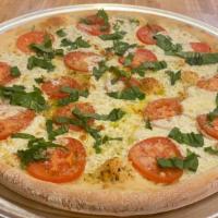 Margarita Pizza  · with Fresh tomatoes, Basil, Garlic Sauce, Oregon leaf, Parmesan Cheese, fresh Mozzarella. An...