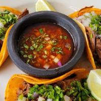 Beef Birria (3 Tacos)  · Shredded beef cooked in our unique ingredients, blasting with flavor. Served on corn tortill...