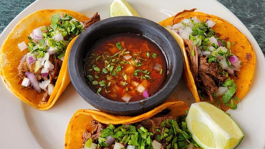 Beef Birria (3 Tacos)  · Shredded beef cooked in our unique ingredients, blasting with flavor. Served on corn tortilla cooked in red sauce, shredded beef, onion, cilantro and extra sauce for dipping.