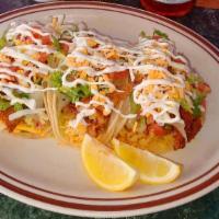 Fish Tacos (3) · Fresh Fried Fish served in a corn tortilla with rice, lettuce, pico de gallo  and house dres...