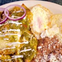Chilaquiles Verdes · Tortilla chips simmered in our homemede salsa verde topped with queso fresco and sour cream....
