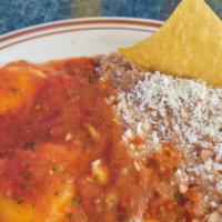 Huevos Rancheros · Eggs served sunny-side up, topped with salsa ranchera. Served with beans.
